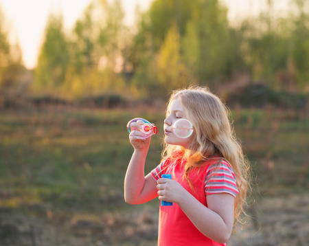 happy girl with soap bubblesの写真素材