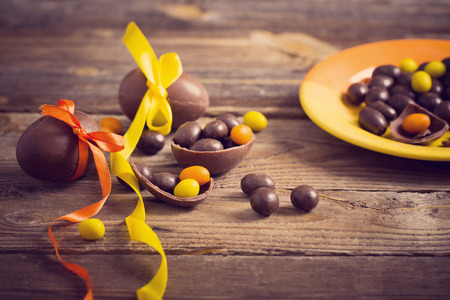 Chocolate Easter Eggs Over Wooden Tableの写真素材