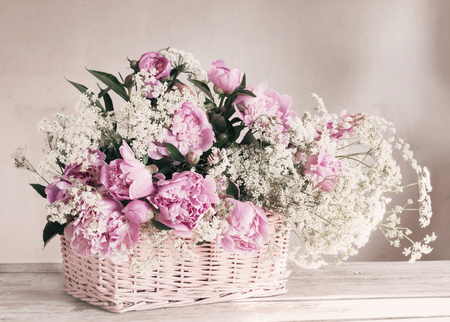 pink peony in basketの写真素材