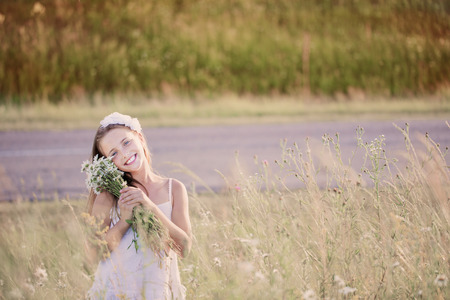 child girl at chamomile fieldの写真素材