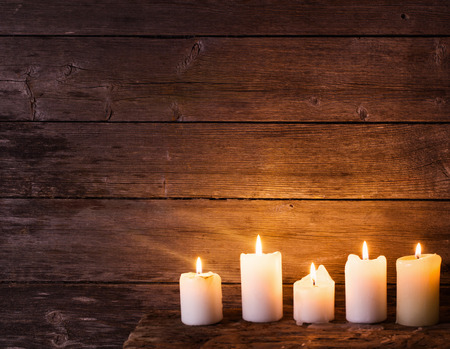 candles on old wooden backgroundの写真素材