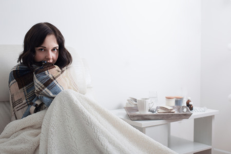 sick girl in bedの写真素材