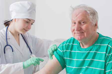 Vaccinating An Elderly Personの写真素材