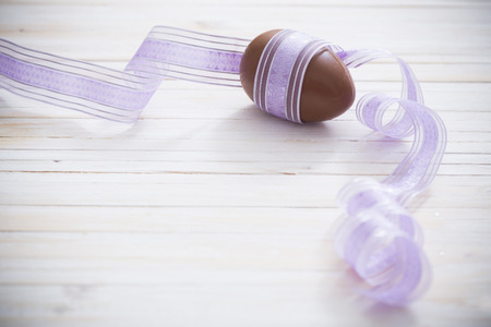 Chocolate Easter Eggs Over Wooden Backgroundの写真素材