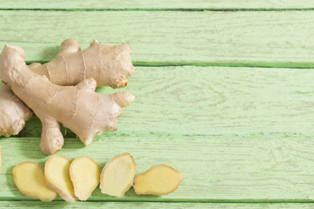 Ginger on wooden background