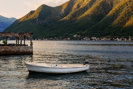 old boat on background mountainsの写真素材