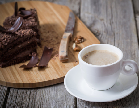 Chocolate cake on old wooden tableの写真素材