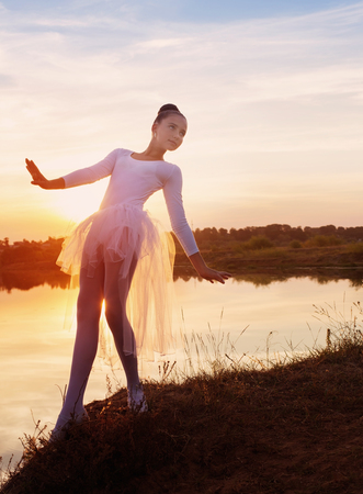 Silhouette of a Ballet Dancer at Sunset Outdoorsの写真素材