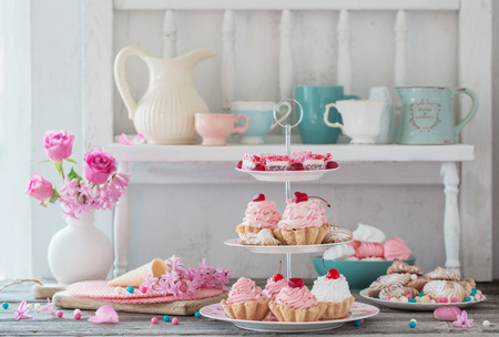 pink cakes on plate on white backgroundの写真素材