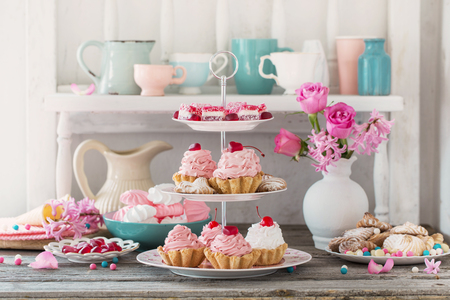 pink cakes on plate on white backgroundの写真素材