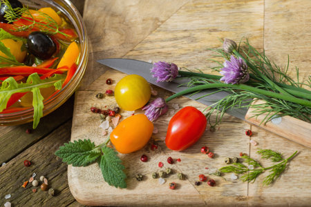vegetables and olives on old wooden backgroundの写真素材
