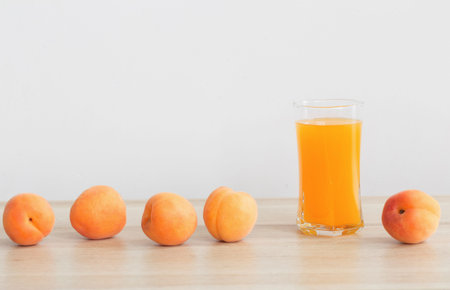 peach juice on wooden table