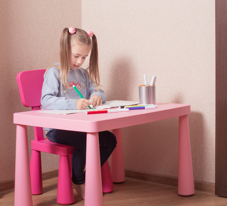 happy girl  drawing at homeの写真素材