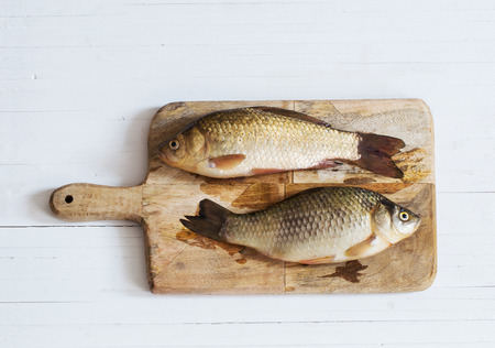river raw fish on wooden tableの写真素材