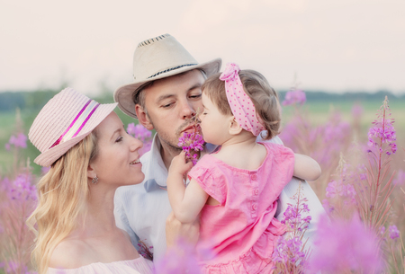 happy family in flowers meadowの写真素材