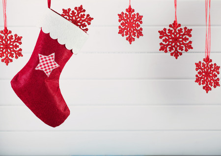 Christmas stocking hanging against wooden backgroundの写真素材