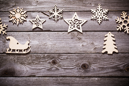 wooden snowflakes and srars on old dark backgroundの写真素材