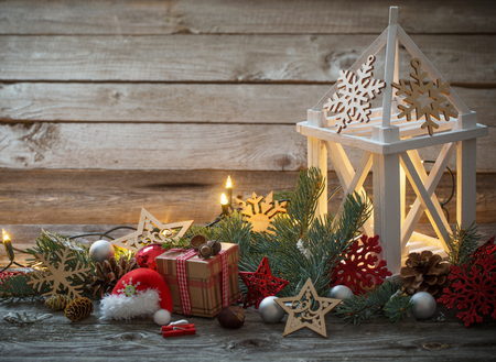Christmas decoration with white lantern  on wooden backgroundの写真素材