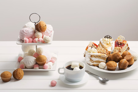 cup of coffee and dessert on white backgroundの写真素材
