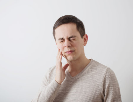 young man with toothache