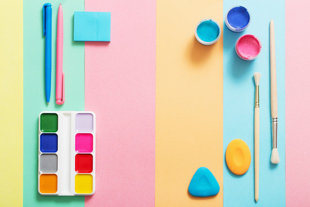 school supplies at  colorful paper background textureの写真素材