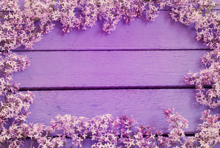 lilac flowers on wooden backgroundの写真素材