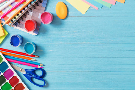 Collection of school supplies on blue wooden backgroundの写真素材