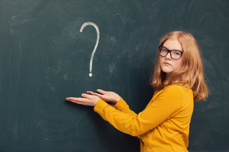 schoolgirl at the blackboardの写真素材