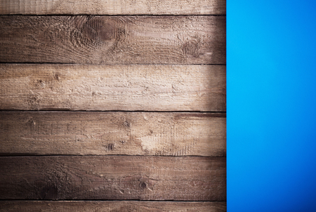 blue paper on a wooden backgroundの写真素材