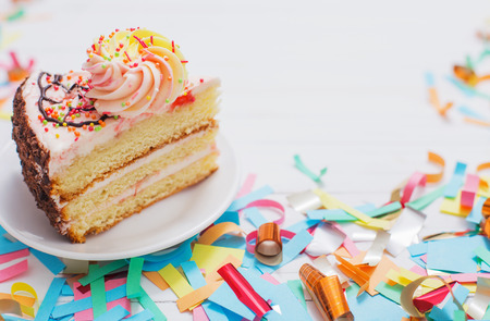 birthday cake and  decoration on white wooden backgroundの写真素材