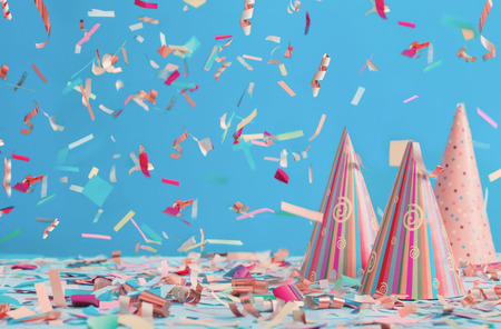 birthday hat and confetti  on blue backgroundの写真素材