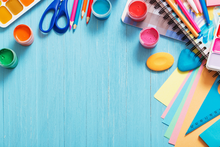 Collection of school supplies on blue wooden backgroundの写真素材