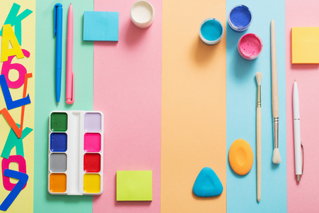 school supplies at  colorful paper background textureの写真素材