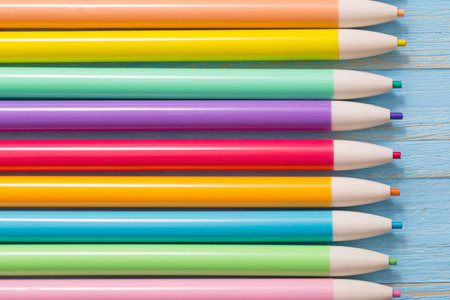 pencils on  blue wooden background