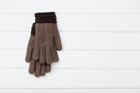 gloves on white wooden backgroundの写真素材