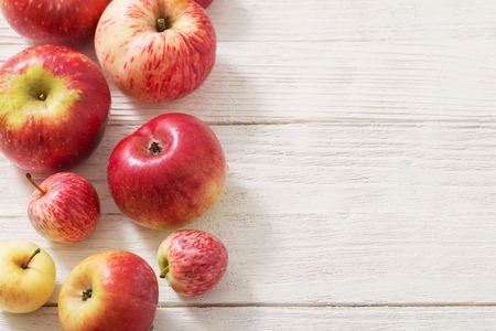 the apples on wooden white backgroundの写真素材