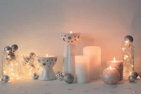 Christmas decoration with candles on background  white wallの写真素材