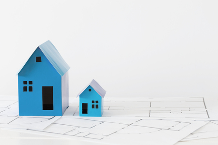 blue paper houses on wooden tableの写真素材