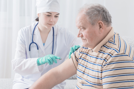Vaccinating An Elderly Personの写真素材