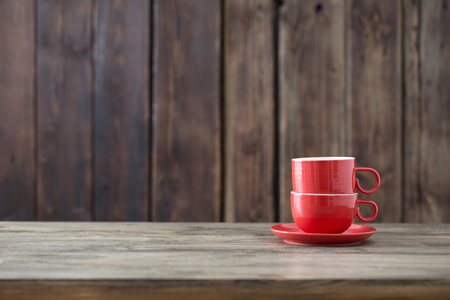 clean empty cup on old wooden backgroundの写真素材