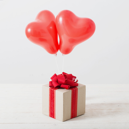 heart shaped red balloons on white backgroundの写真素材