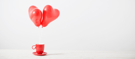 heart shaped red balloons on white backgroundの写真素材