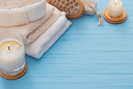 Spa concept with candles on blue wooden backgroundの写真素材