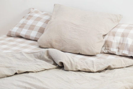 light linen bedclothes on bed