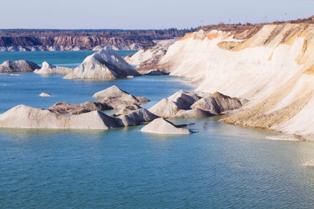 Old open-cast chalk mine with lake in quarryの写真素材