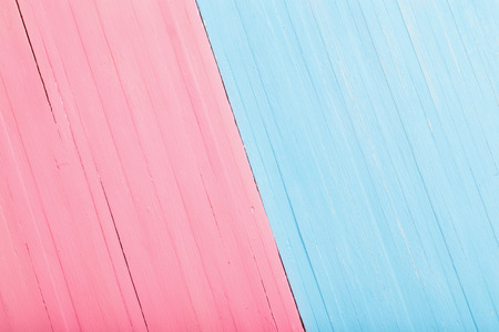 Pink and blue wooden background. Man and woman conceptの写真素材
