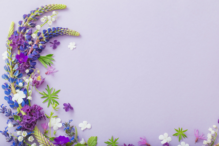 purple, blue, pink flowers on paper backgroundの写真素材