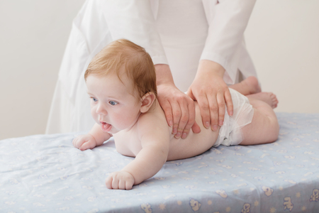nurse does massage to babyの写真素材
