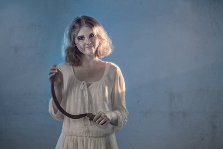 scary girl in white dress from horror film in  room