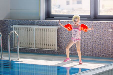 little girl in swimming poolの写真素材